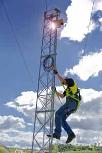 Employee Climbing Security Tower